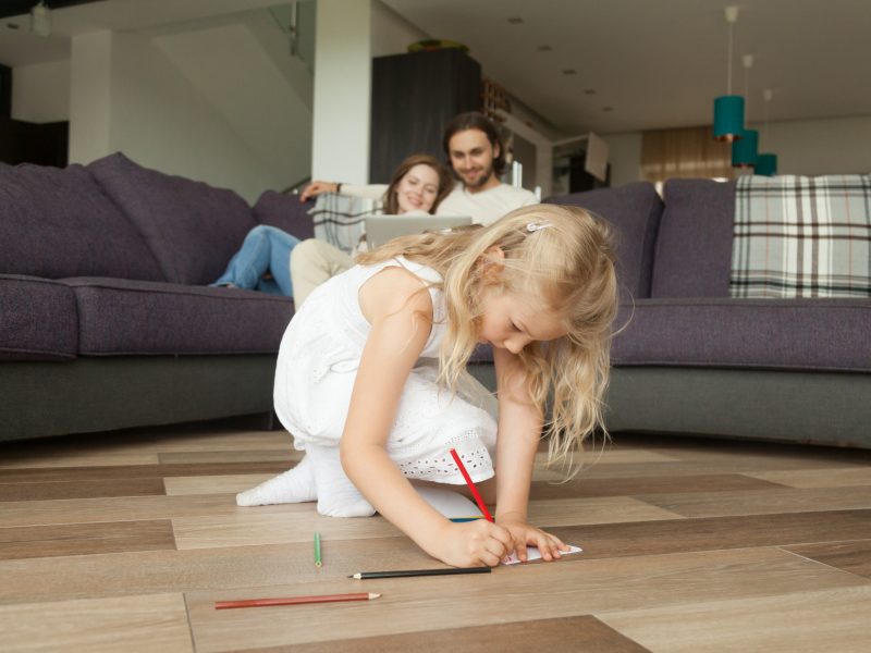 cute-girl-daughter-drawing-with-colored-pencils-playing-at-home